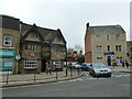 Looking across the High Street towards a pub