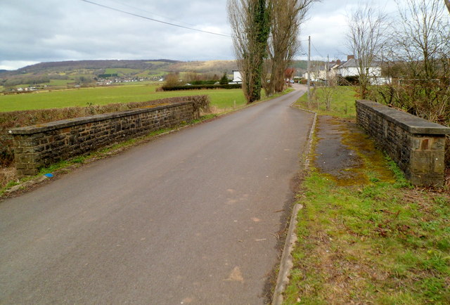 Road to Trewen crosses a drainage channel bridge