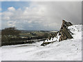 SK5014 : Beacon Hill: crags and snow clouds by John Sutton