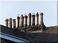 NU0051 : Chimney-pots in Spittal by Barbara Carr