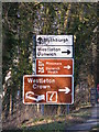 TM3968 : Roadsigns on the A12 Main Road by Geographer