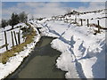 SO3496 : Snow blocked road near the Stiperstones by Dave Croker