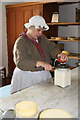 SJ9921 : Shugborough Park Farm - making butter by Chris Allen