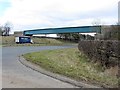 NZ0665 : Footbridge over A69 at Nafferton Farm by Andrew Curtis