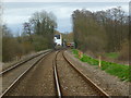 Train at Mottisfont and Dunbridge Station seen from footpath to the west