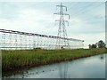 TL5888 : Safety scaffolding beneath power lines crossing the River Great Ouse by Rose and Trev Clough