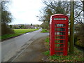 Road with telephone box at Butt