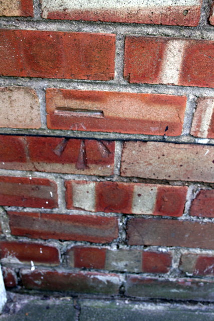 Benchmark on the garage of #53 Asfordby Road