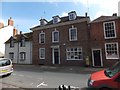 Newent post office, with gold post box