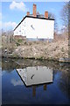 House reflected in the Worcester and Birmingham Canal