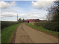 NU1135 : Roadside farm building at Easington Grange by Graham Robson