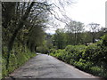 Cyclist, climbing the hill, north of Milverton