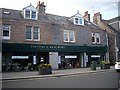NO6995 : Extended shop frontage in Banchory High Street by Stanley Howe