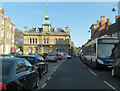 SP6948 : Watling Street passes Towcester Town Hall by Stuart Logan