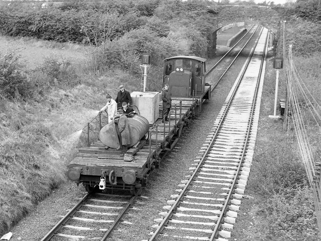 Weed control train leaving Ballinderry (1975)