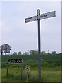 TM2993 : Roadsigns on Church Road by Geographer