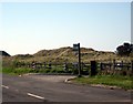 Bus stop and entrance to beach car park