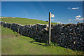 NY6109 : Fingerpost and Stile above Orton by Tom Richardson