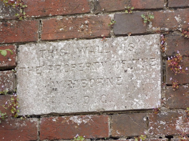 Wimborne Minster: wall ownership stone