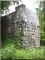 A road bridge abutment by the Old Deeside Railway track