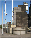 NT2674 : Lamps and flagstaffs at entrance to St Andrew's House, Regent Road by Robin Stott