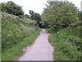 Old railway track cycle path heading towards the old town