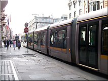 O1534 : A LUAS tram in Abbey Street by Eric Jones