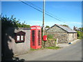 SX1686 : Telephone box, post box & bus shelter in Tremail village by Rod Allday