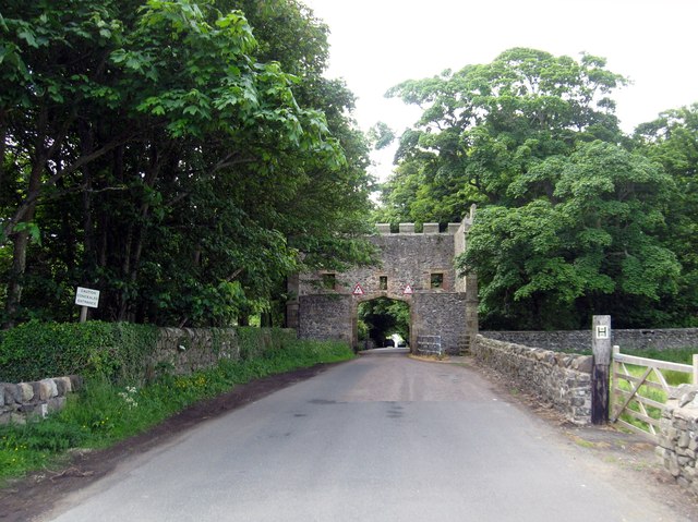 18th. century gateway, in the Gothick style,  astride the country road near Craster Tower