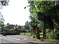 Gate and house on Pirbright Road, Normandy