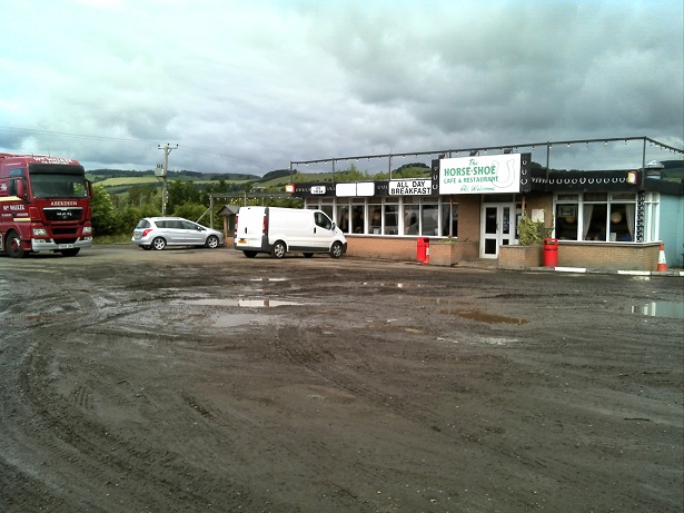 Muddy carpark of the roadside cafe