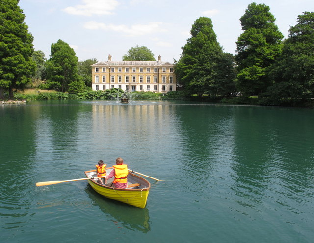 Rowing boat on pond in front of Kew Gardens museum
