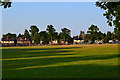 Evening shadows across the village green at Send