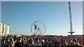 View of the Vue wheel and another ride in the funfair at Go Local from the green at the back of the Velodrome