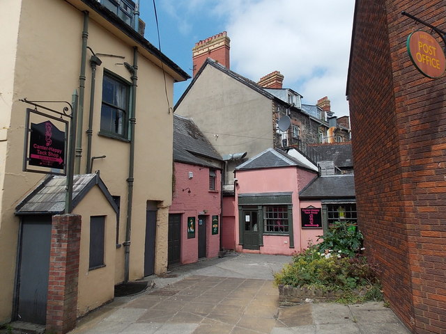 Pink buildings in a yard, Brecon