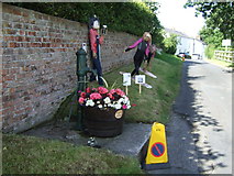 TA0979 : Pump and scarecrows, West End, Muston by JThomas