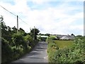 J2617 : Approaching the farm and brewery on the Tullyframe Road by Eric Jones