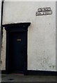 Street name and dark door, Denbigh