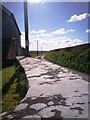 Henllan Amgoed Chapel - back wall and farm lane