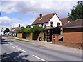 TM2737 : High Road, Bus Shelter & 302 High Road George V Postbox by Geographer