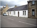 A pair of white-washed cottages in King Street, Huntly