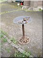 A bird bath in the churchyard