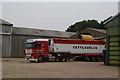 Harvested grain being loaded onto transport