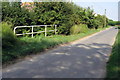 Stream crosses under Wood End Road