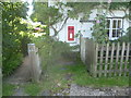 Post box in a cottage wall, Acrise