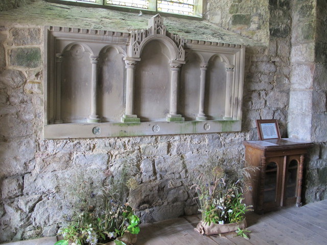 St. Cuthbert's Church, Elsdon - carved stone panel below the west window