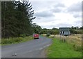 NZ0592 : Postie on his rural round by Russel Wills