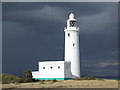 SZ3189 : Keyhaven: Hurst lighthouse against a leaden sky by Chris Downer