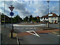 Looking west across small roundabout on Judge Heath Lane