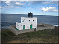NU1735 : Lighthouse at Blackrocks Point, Bamburgh by Graham Robson